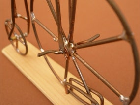 Werkaufgabe mit dem Werkstoff Metall: Hochrad aus Draht